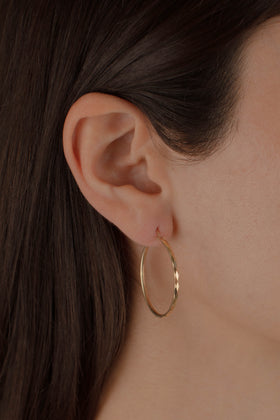 ARRACADA FACETADA 3CM ORO 10K